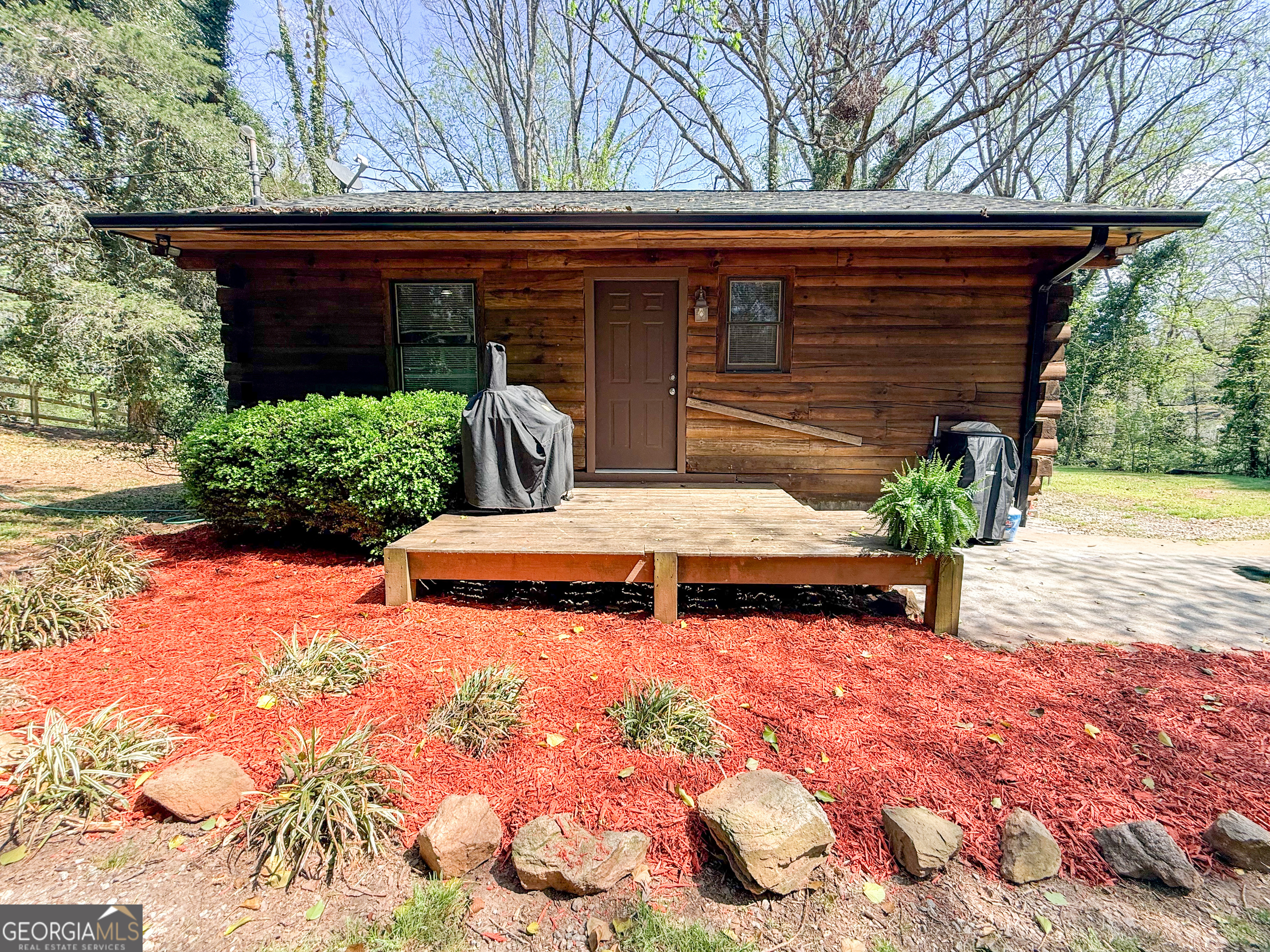 a view of a backyard with chairs