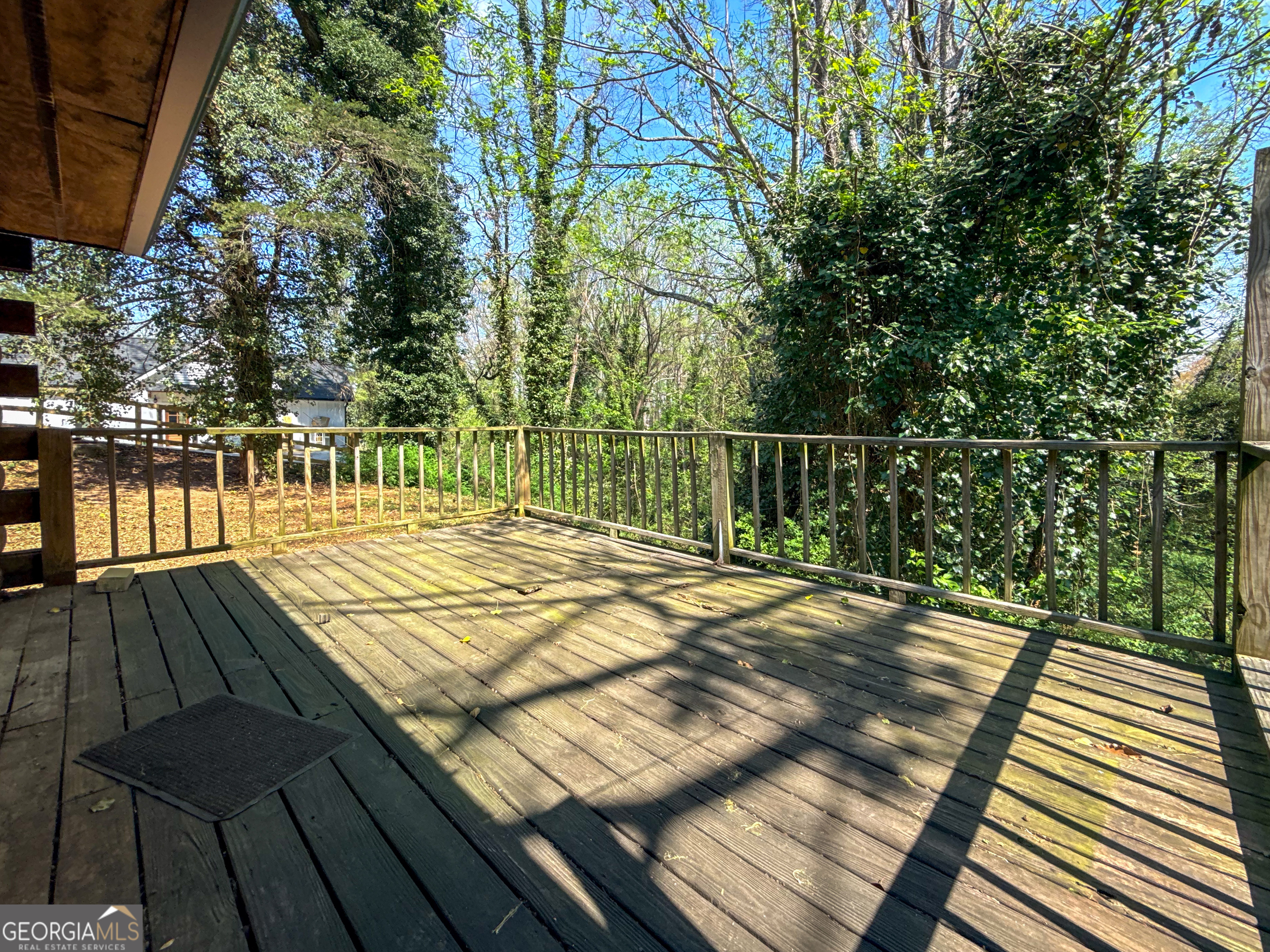 170 Hillcrest Street Cornelia, GA 30531 - Photo 15 of 18 a view of a balcony with wooden floor and large trees
