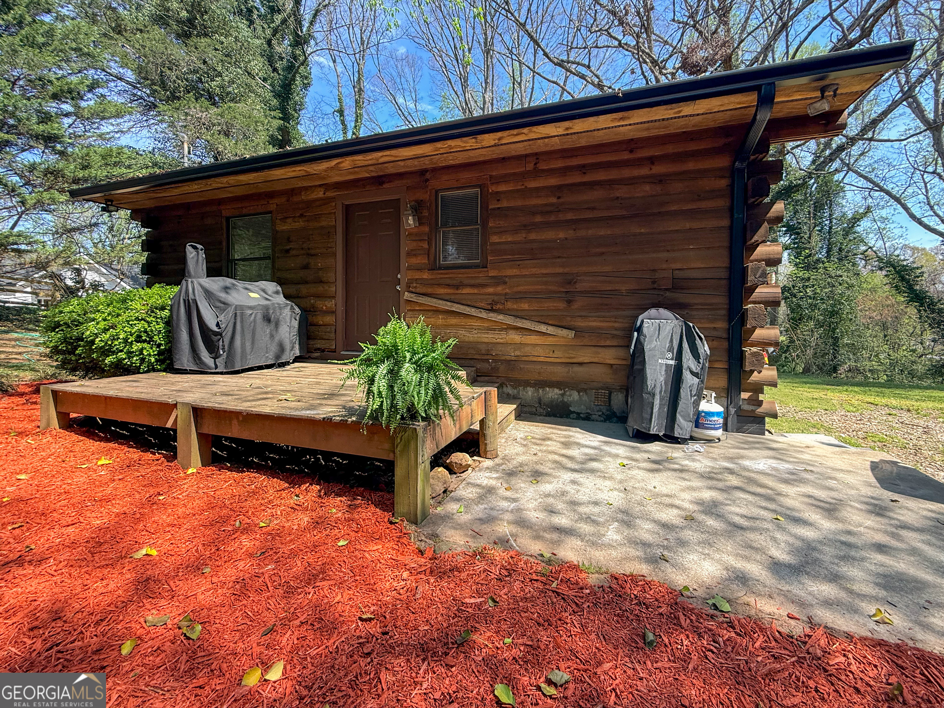 170 Hillcrest Street Cornelia, GA 30531 - Photo 2 of 18 a backyard of a house with barbeque oven and outdoor seating
