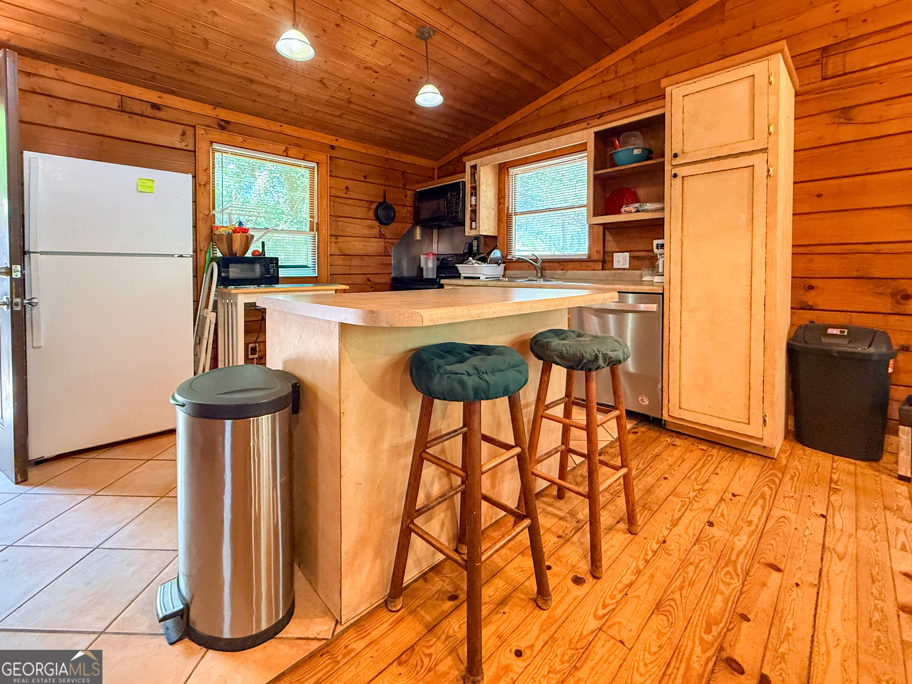 170 Hillcrest Street Cornelia, GA 30531 - Photo 5 of 18 a kitchen with stainless steel appliances kitchen island granite countertop a refrigerator a stove a sink and white cabinets with wooden floor