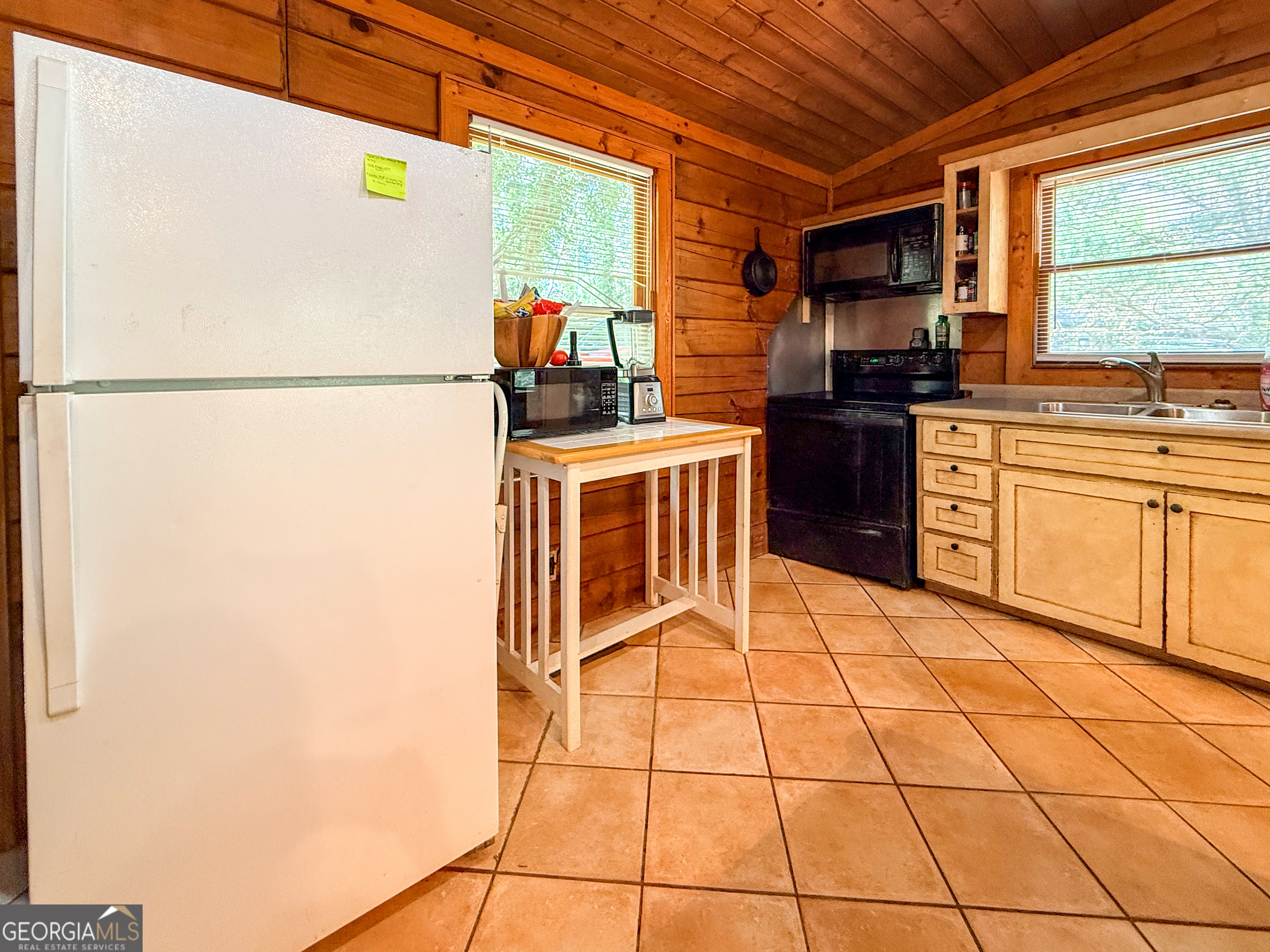 170 Hillcrest Street Cornelia, GA 30531 - Photo 7 of 18 a kitchen with stainless steel appliances a refrigerator sink and cabinets