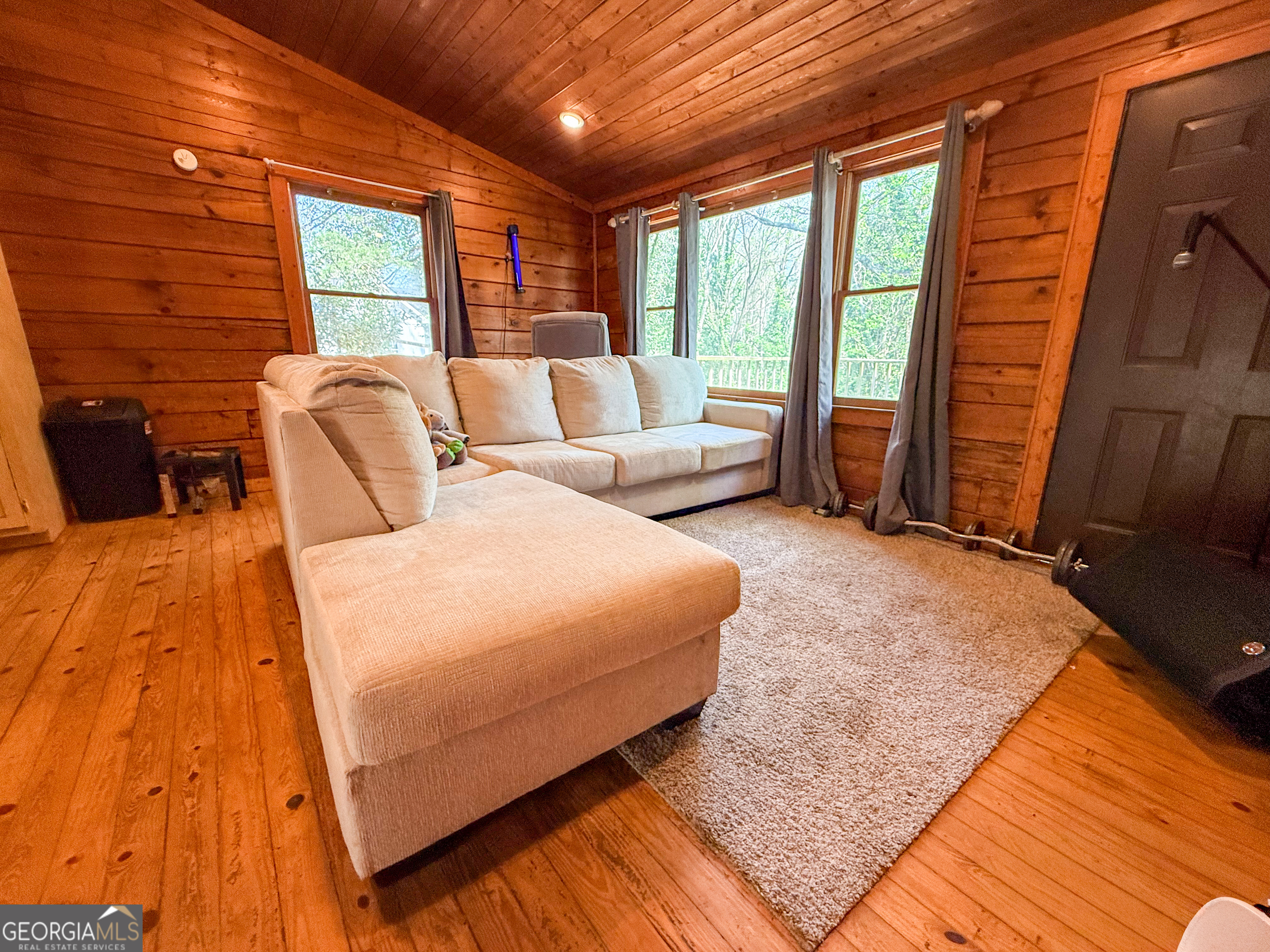 170 Hillcrest Street Cornelia, GA 30531 - Photo 9 of 18 a bedroom with a bed and large windows
