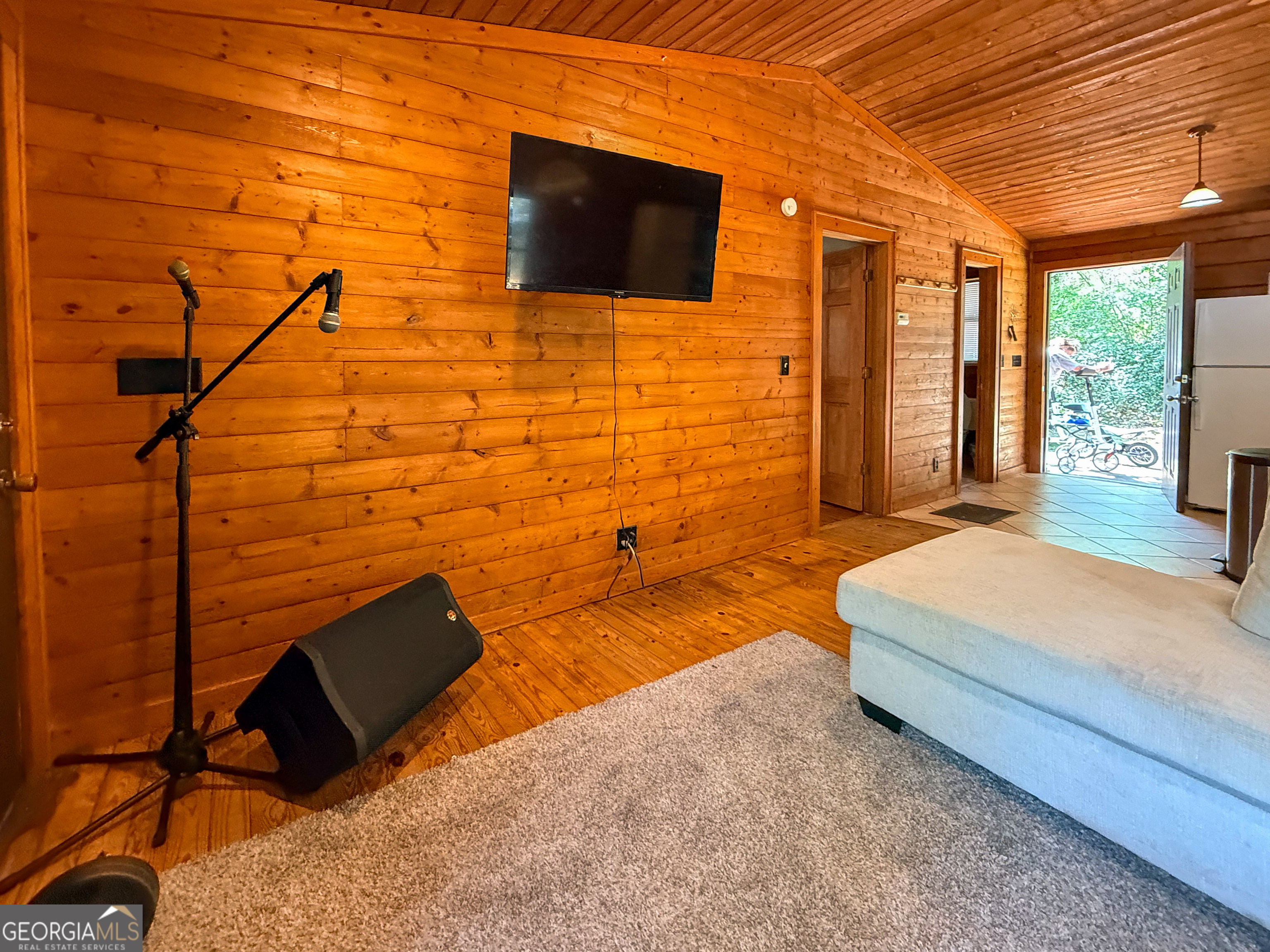 170 Hillcrest Street Cornelia, GA 30531 - Photo 10 of 18 a spacious bedroom with a bed and a flat screen tv