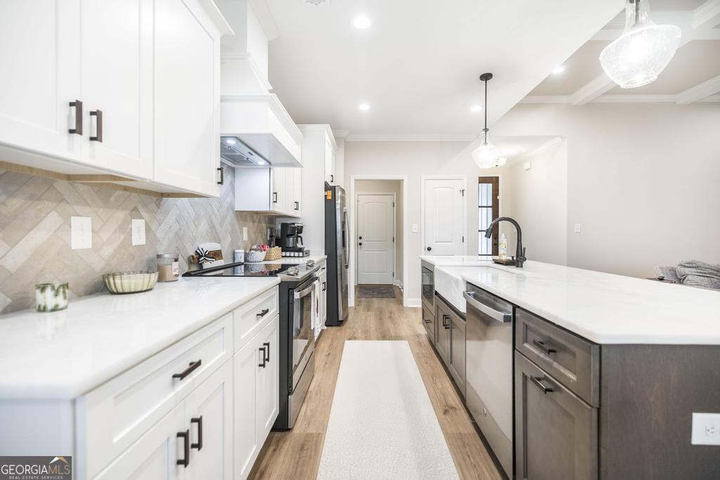 111 Fieldview Lane Kathleen, GA 31047 - Photo 12 of 36 a large kitchen with stainless steel appliances kitchen island a large counter space a sink and cabinets