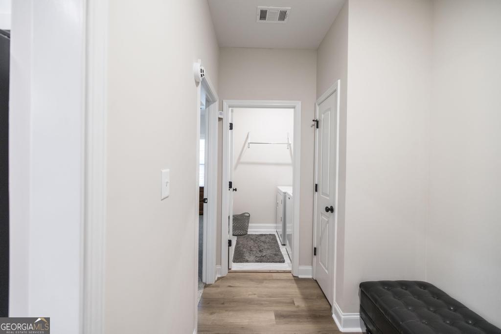 111 Fieldview Lane Kathleen, GA 31047 - Photo 14 of 36 a view of a hallway with a livingroom and a bathroom with sink