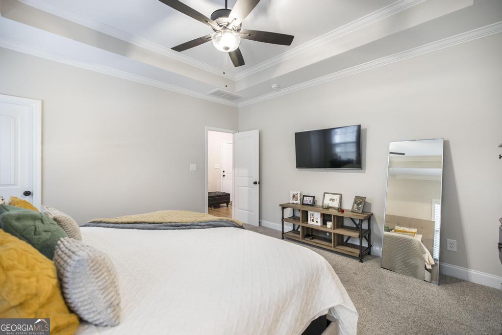 111 Fieldview Lane Kathleen, GA 31047 - Photo 17 of 36 a bedroom with a bed and a flat tv screen on dresser