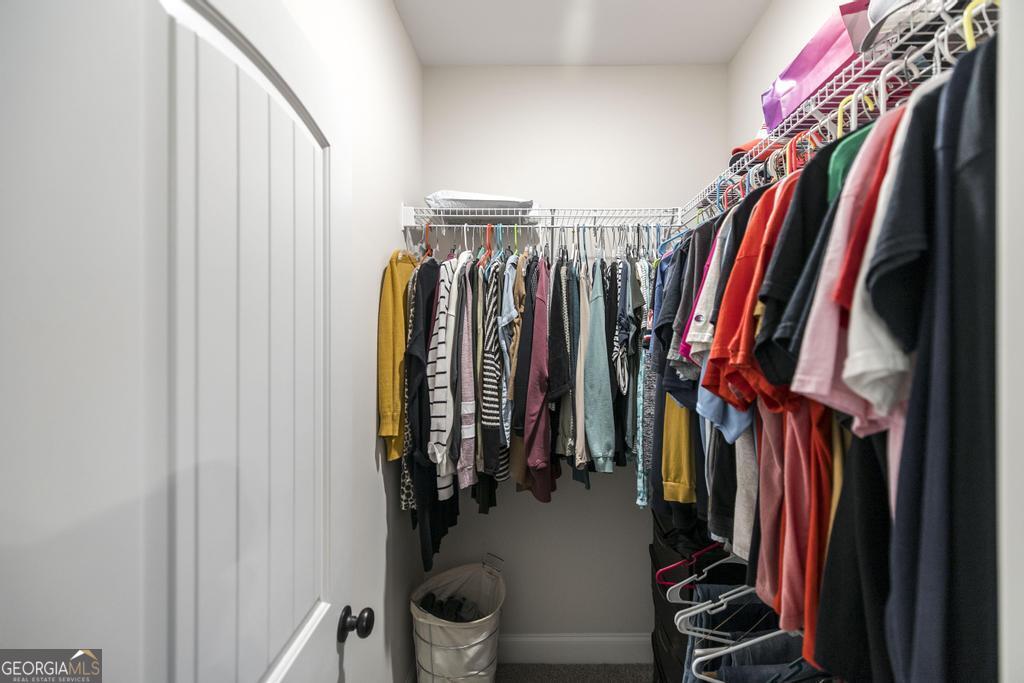 111 Fieldview Lane Kathleen, GA 31047 - Photo 21 of 36 a view of walk in closet with clothes