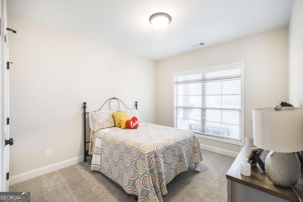 111 Fieldview Lane Kathleen, GA 31047 - Photo 22 of 36 a bedroom with a bed and a window