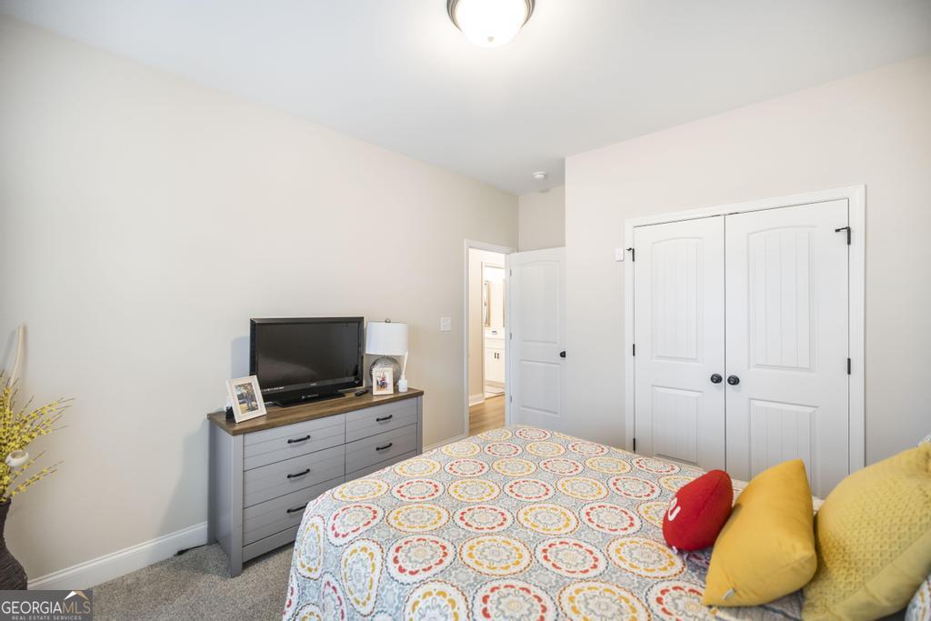 111 Fieldview Lane Kathleen, GA 31047 - Photo 23 of 36 a bedroom with a bed and a flat screen tv