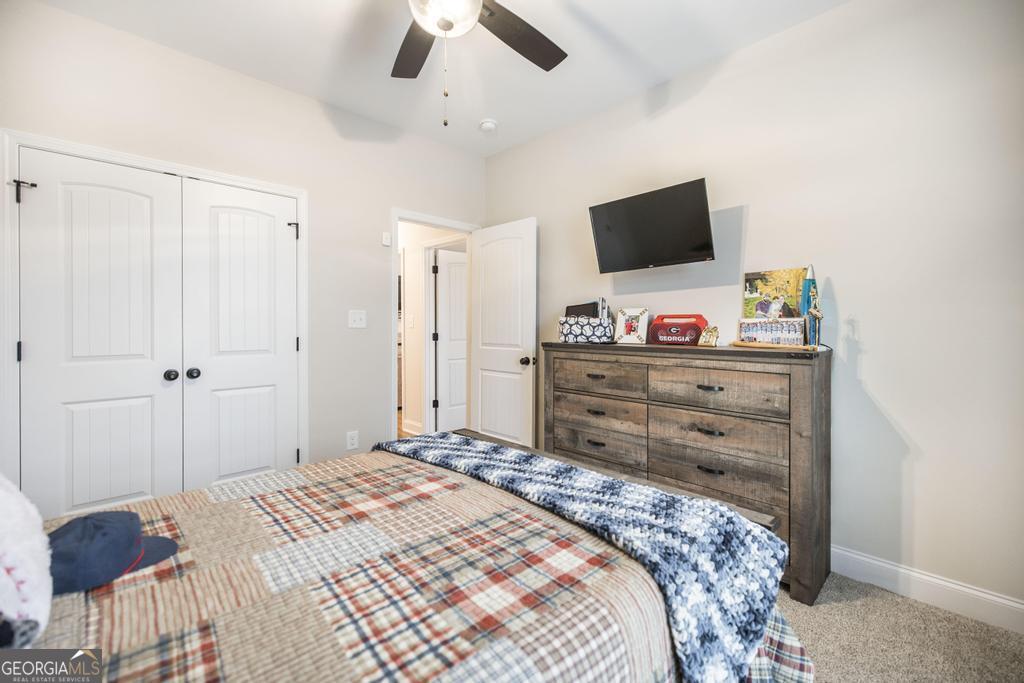 111 Fieldview Lane Kathleen, GA 31047 - Photo 25 of 36 a bedroom with a bed and a flat screen tv