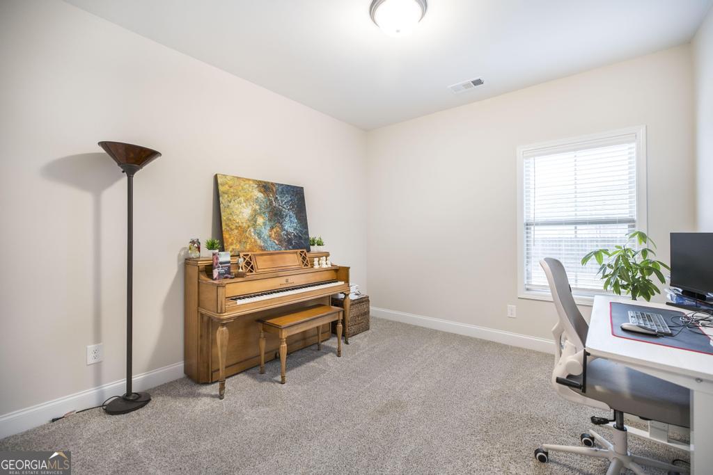 111 Fieldview Lane Kathleen, GA 31047 - Photo 27 of 36 a room with a desk and chair