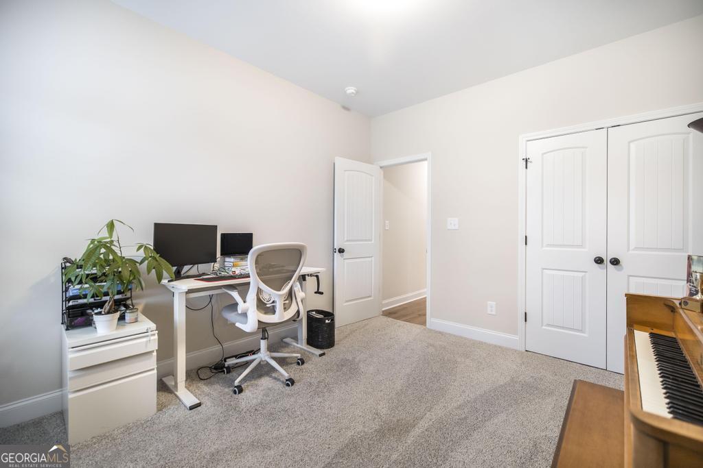 111 Fieldview Lane Kathleen, GA 31047 - Photo 28 of 36 a view of a workspace with furniture and a window