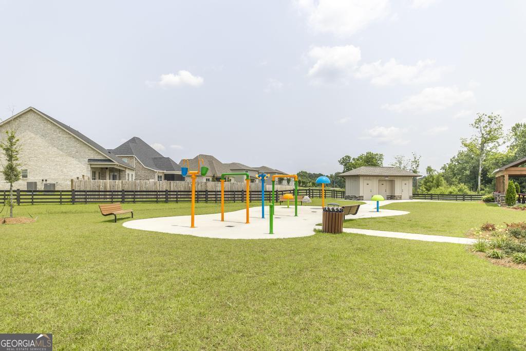 111 Fieldview Lane Kathleen, GA 31047 - Photo 35 of 36 a view of an swimming pool with an outdoor space and seating area