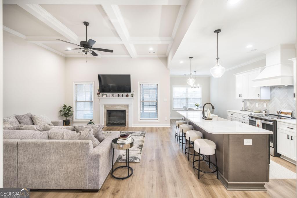 111 Fieldview Lane Kathleen, GA 31047 - Photo 5 of 36 a living room with furniture a fireplace and a flat screen tv