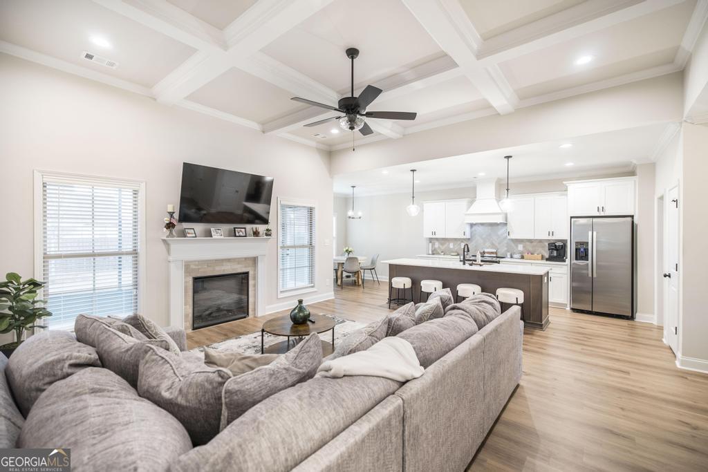 111 Fieldview Lane Kathleen, GA 31047 - Photo 6 of 36 a living room with furniture a fireplace and a flat screen tv