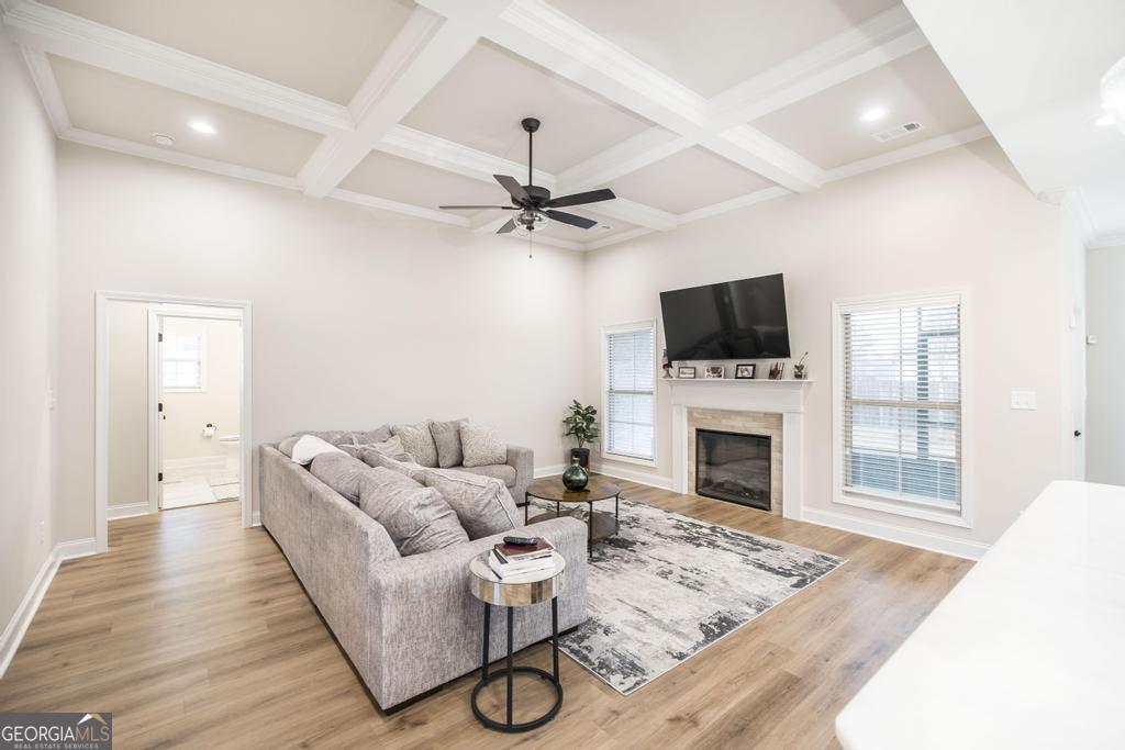 111 Fieldview Lane Kathleen, GA 31047 - Photo 7 of 36 a living room with furniture a fireplace and a flat screen tv