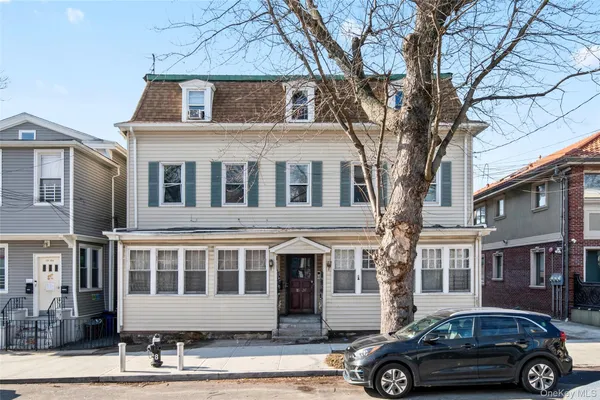 a car parked in front of a house