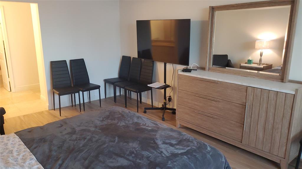 1000 South Ocean Boulevard, Unit PHF Pompano Beach, FL 33062 - Photo 8 of 8 a bedroom with a bed and chair