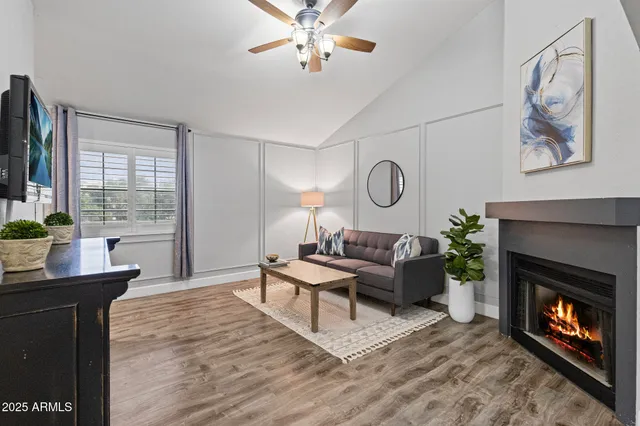 a living room with furniture and a fireplace
