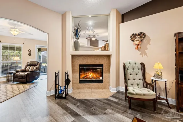 a living room with furniture and a fireplace