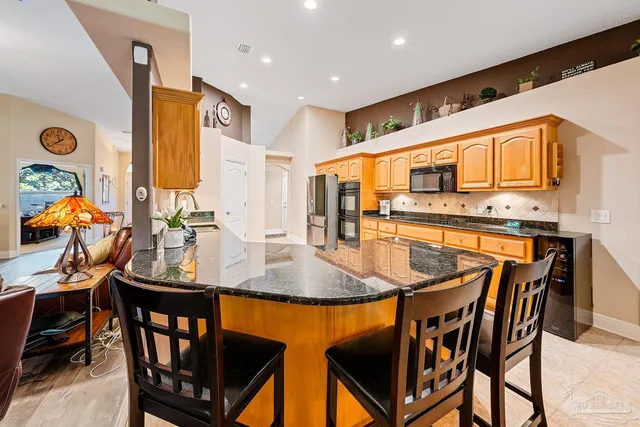 a view of a refrigerator and an oven