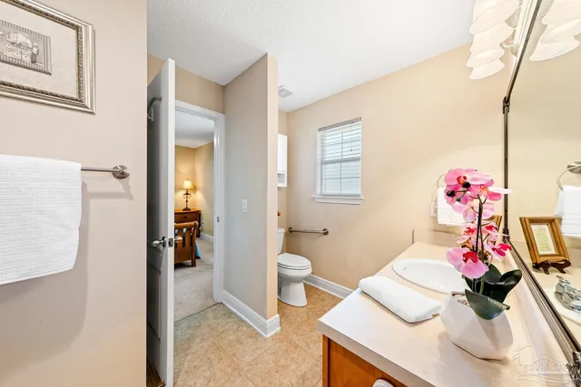 a bed room with a bed and a chair