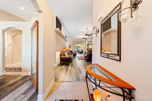 a view of a hallway with living room and a furniture