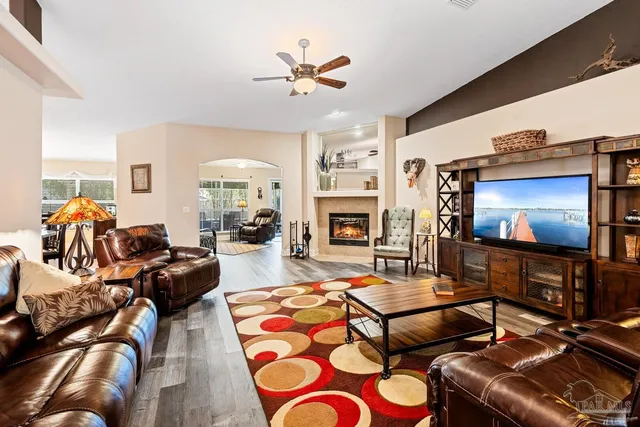 a living room with furniture and a flat screen tv