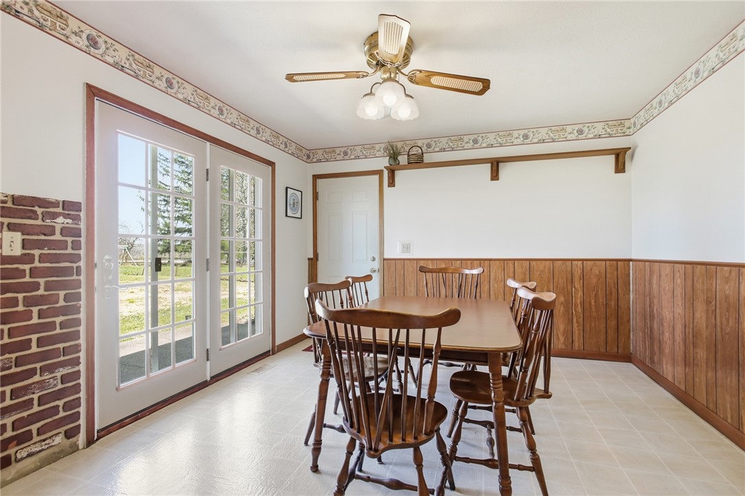6718 Old Columbus Road South Vienna, OH 45369 - Photo 13 of 33 This bright dining area features French doors and practical vinyl flooring.