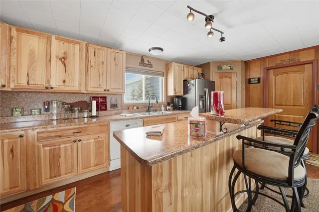 a kitchen with a sink stove and white cabinets