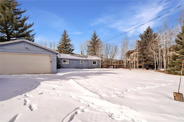 a view of the house with a yard