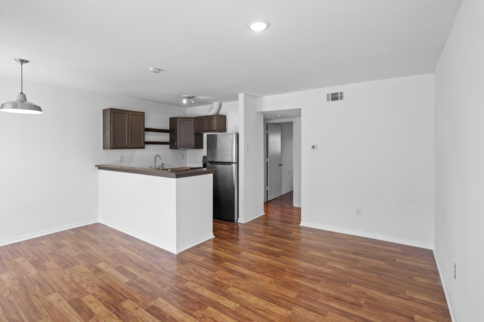 1408 Hughes Street, Unit 4 Houston, TX 77023 - Photo 10 of 27 The living, dining areas and kitchen are open concept for gracious living and entertaining.