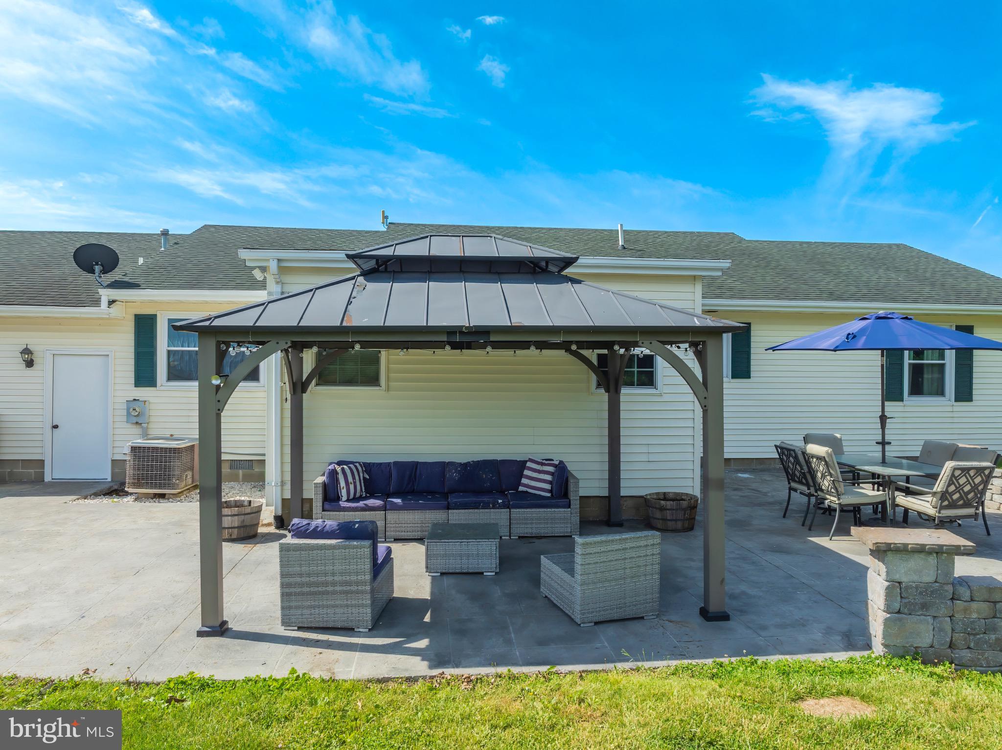 25612 Auction Road Federalsburg, MD 21632 - Photo 8 of 71 a view of a patio with swimming pool table and chairs