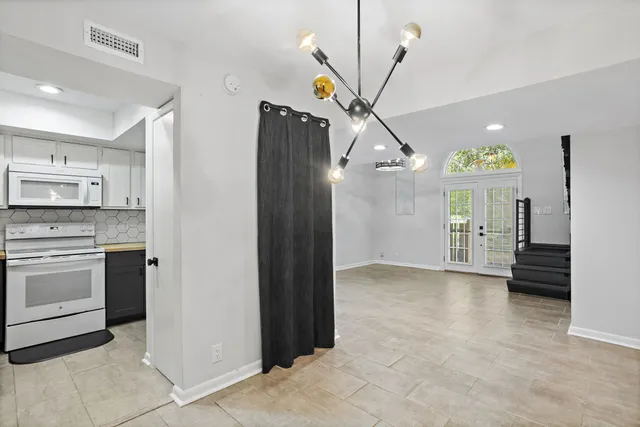 a view of an entryway with kitchen
