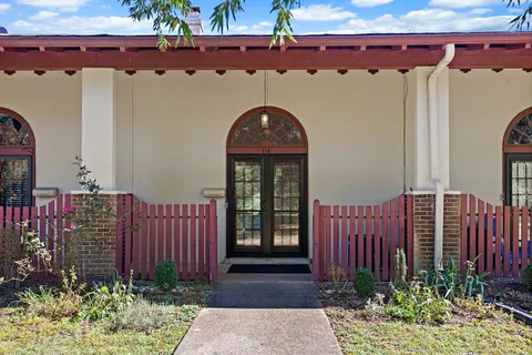 a front view of a house with garden