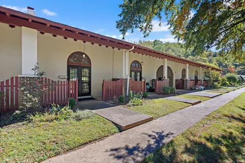 a front view of house with pathway and yard