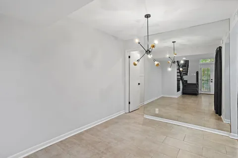 a view of a kitchen with a sink and refrigerator