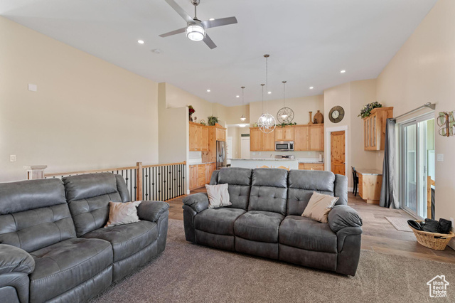 19502 South Olson Road Downey, ID 83234 - Photo 11 of 64 Living room featuring recessed lighting, a ceiling fan, light wood finished floors, and a towering ceiling