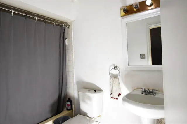 a bedroom with furniture and a chandelier