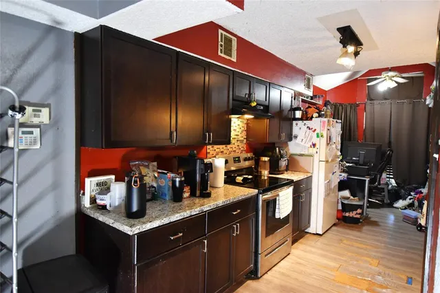 a kitchen with lots of counter space and appliances