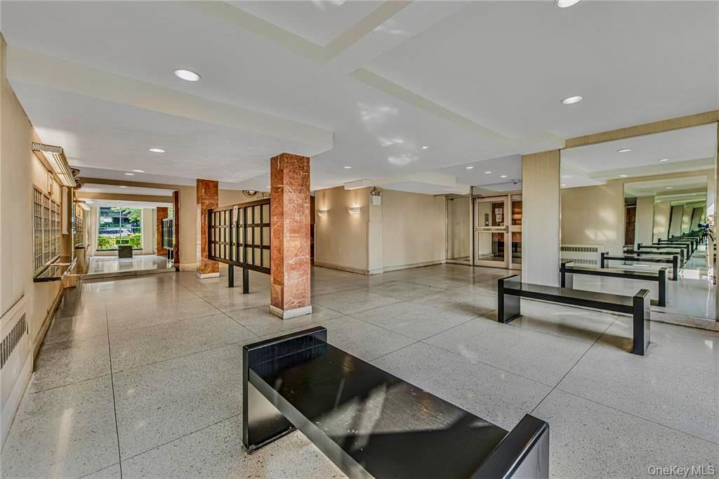 5550 Fieldston Road, Unit 1C ON 2 Bronx, NY 10471 - Photo 3 of 22 a lobby with furniture and stairs