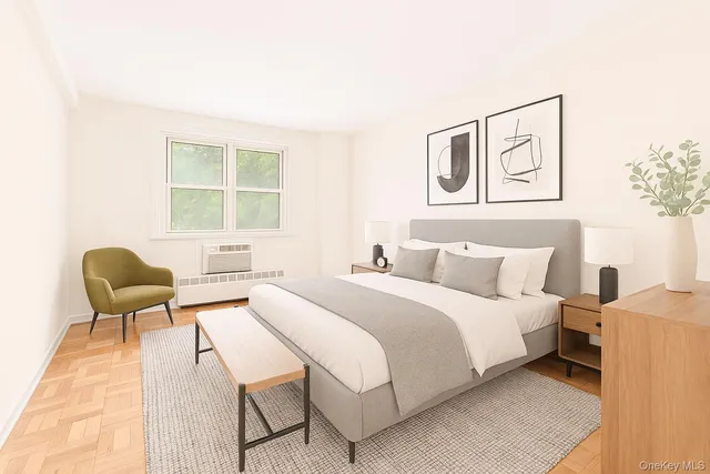 a bedroom with a bed and a large window