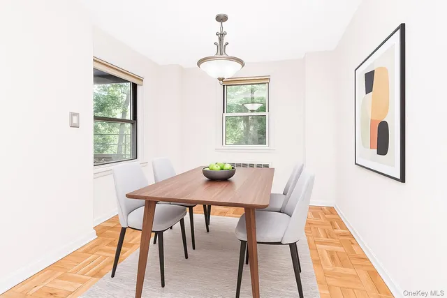 a view of a dining room with furniture and window
