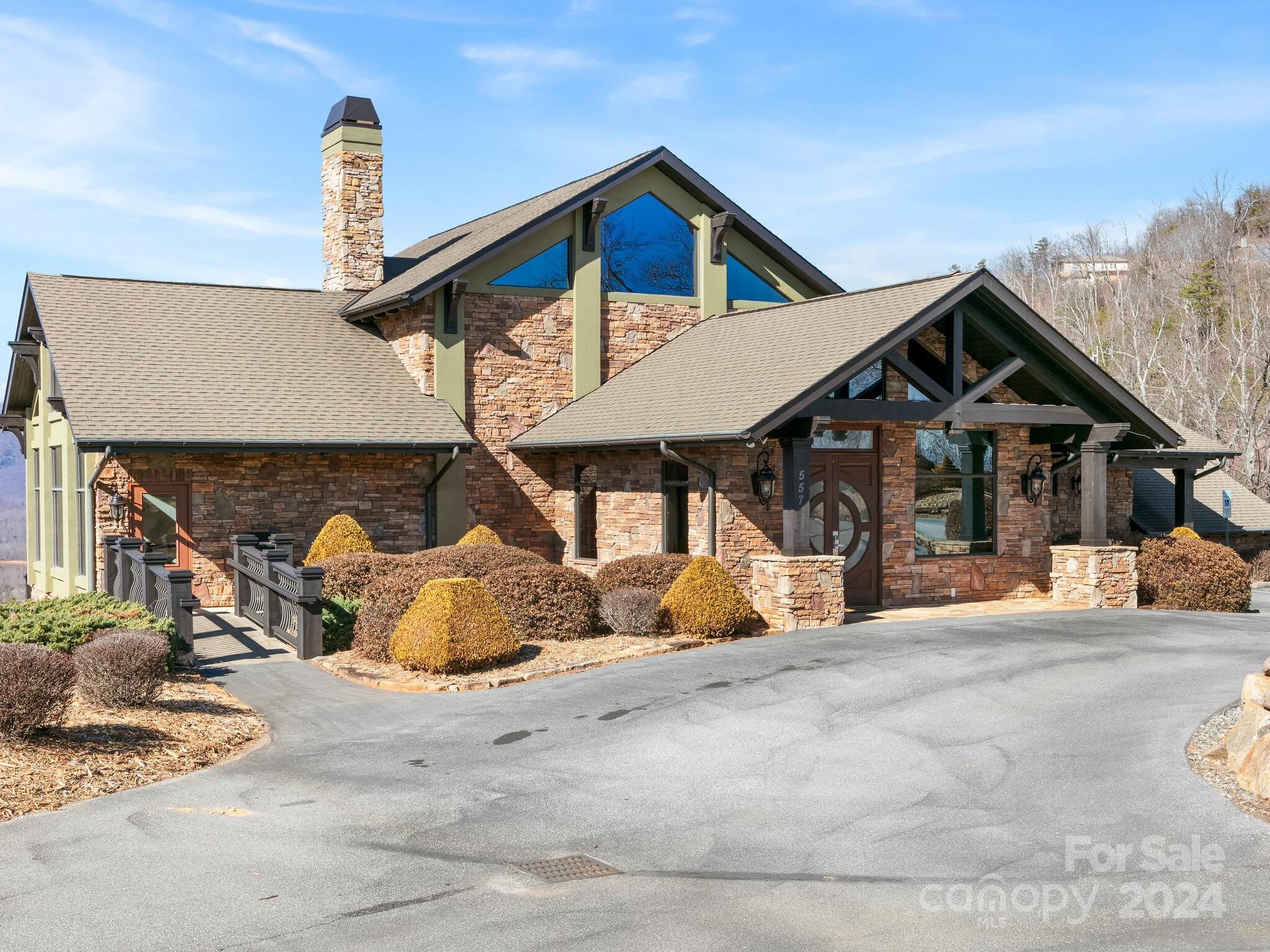 0 Golden Ridge Drive, Unit 133 Lake Lure, NC 28746 - Photo 7 of 14 a front view of a house with a yard