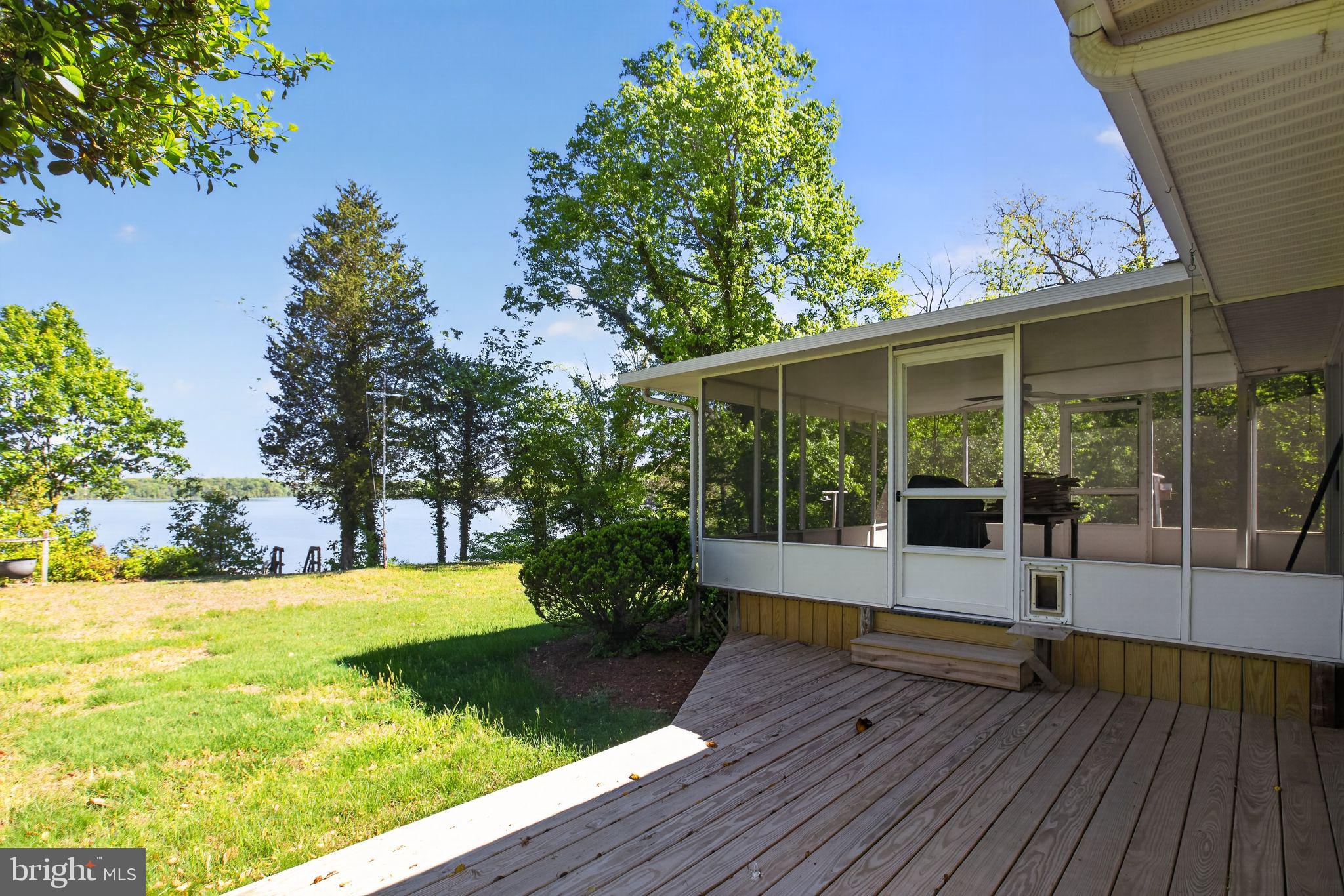 5480 Grinder Road Marbury, MD 20658 - Photo 8 of 44 Serene lakeside retreat with lush greenery.