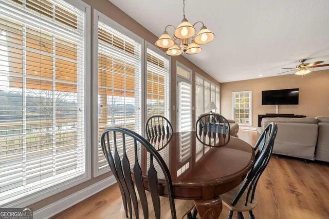 a view of a dining room with furniture window and wooden floor