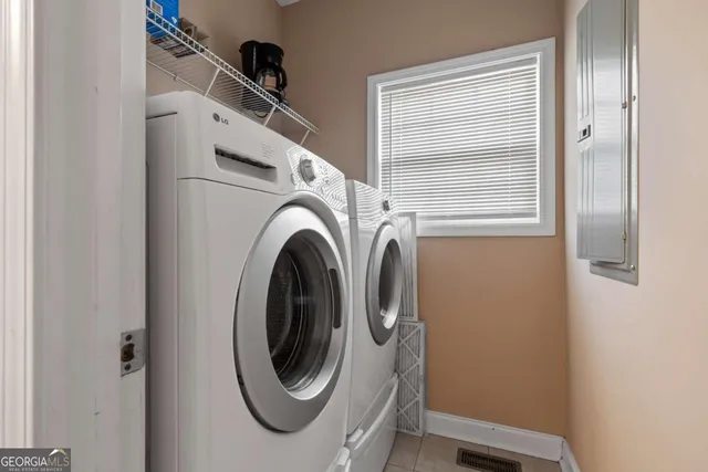 a utility room with dryer and washer