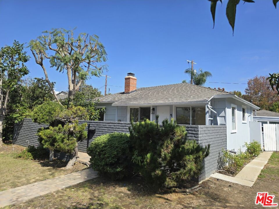 2520 Midvale Avenue Los Angeles, CA 90064 - Photo 2 of 25 a front view of a house with a yard