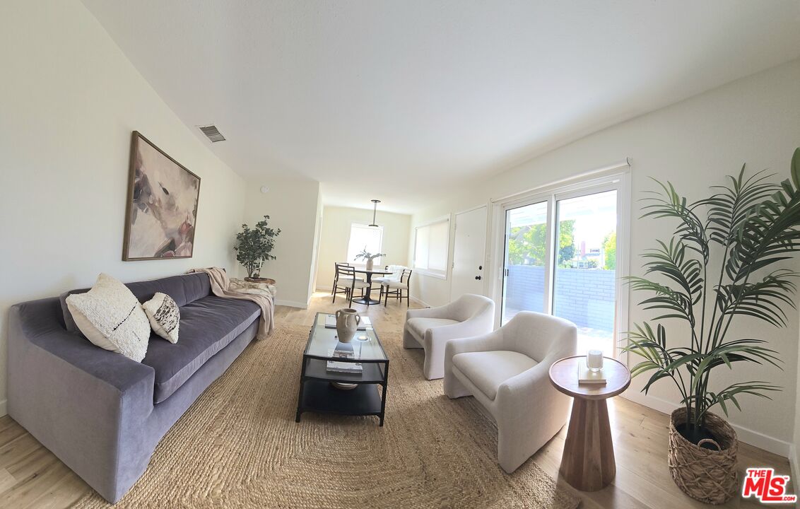 2520 Midvale Avenue Los Angeles, CA 90064 - Photo 5 of 25 a living room with furniture and a large window