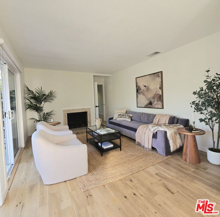 2520 Midvale Avenue Los Angeles, CA 90064 - Photo 6 of 25 a bedroom with a bed and a potted plant